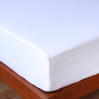 100% linen fitted sheet on a wooden bed frame.