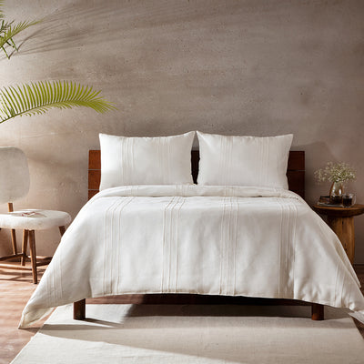 Ivory Pearl Heirloom European flax linen duvet cover set on a luxury styled bed – hand-tailored pintucks and Victorian hemstitching, 100% pure linen, Whites of London India