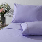 Lavender Mist 200TC organic cotton dyed embroidered sheet set – pastel lavender tone, subtle embroidery detail, breathable percale, single and king sizes