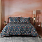 Chintz reversible dohar set on a styled bed – deep blue ground with intricate botanical blooms and flowing vines, organic cotton percale, Whites of London