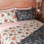 Matching reversible pillowcase from the Chintz dohar set – blue botanical front and coral-ivory floral reverse, organic cotton percale with housewife closure