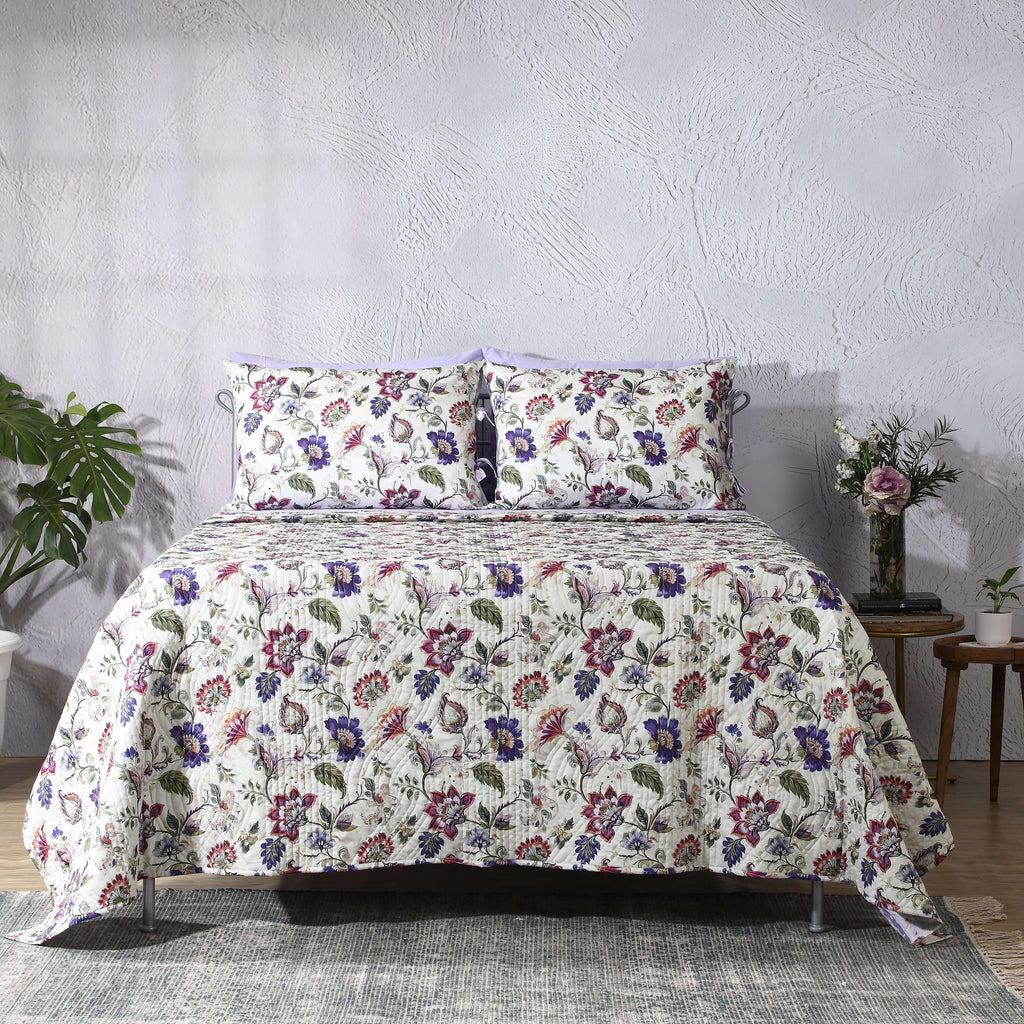 Flat lay of Lavender Fields organic cotton percale dohar – ivory base with lavender, violet and fresh green floral print, reversible design