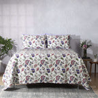 Flat lay of Lavender Fields organic cotton percale dohar – ivory base with lavender, violet and fresh green floral print, reversible design