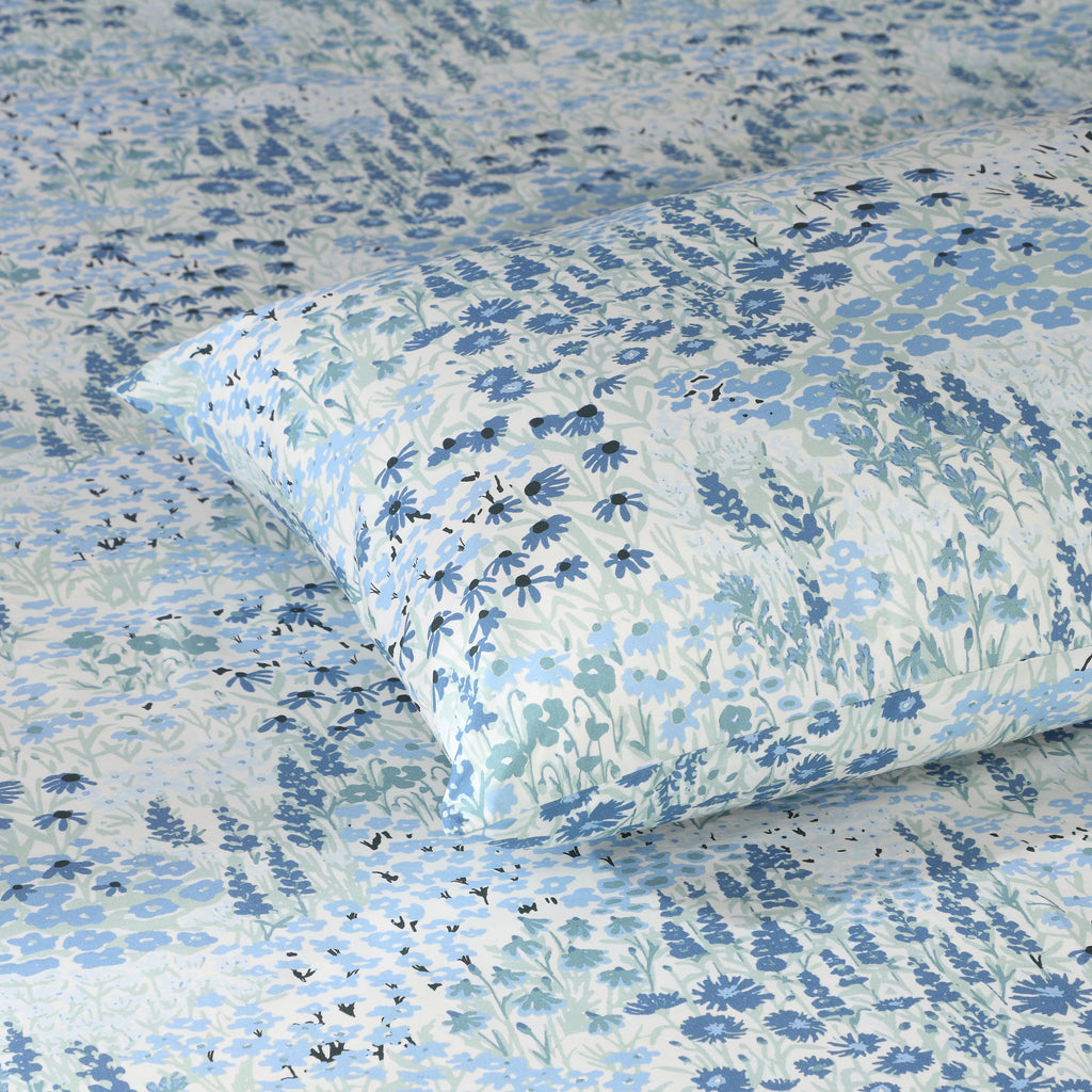 Folded Windflower 200 TC organic percale flat sheet – serene meadow-inspired print with scattered wildflowers and gentle blue and ivory palette, Whites of London