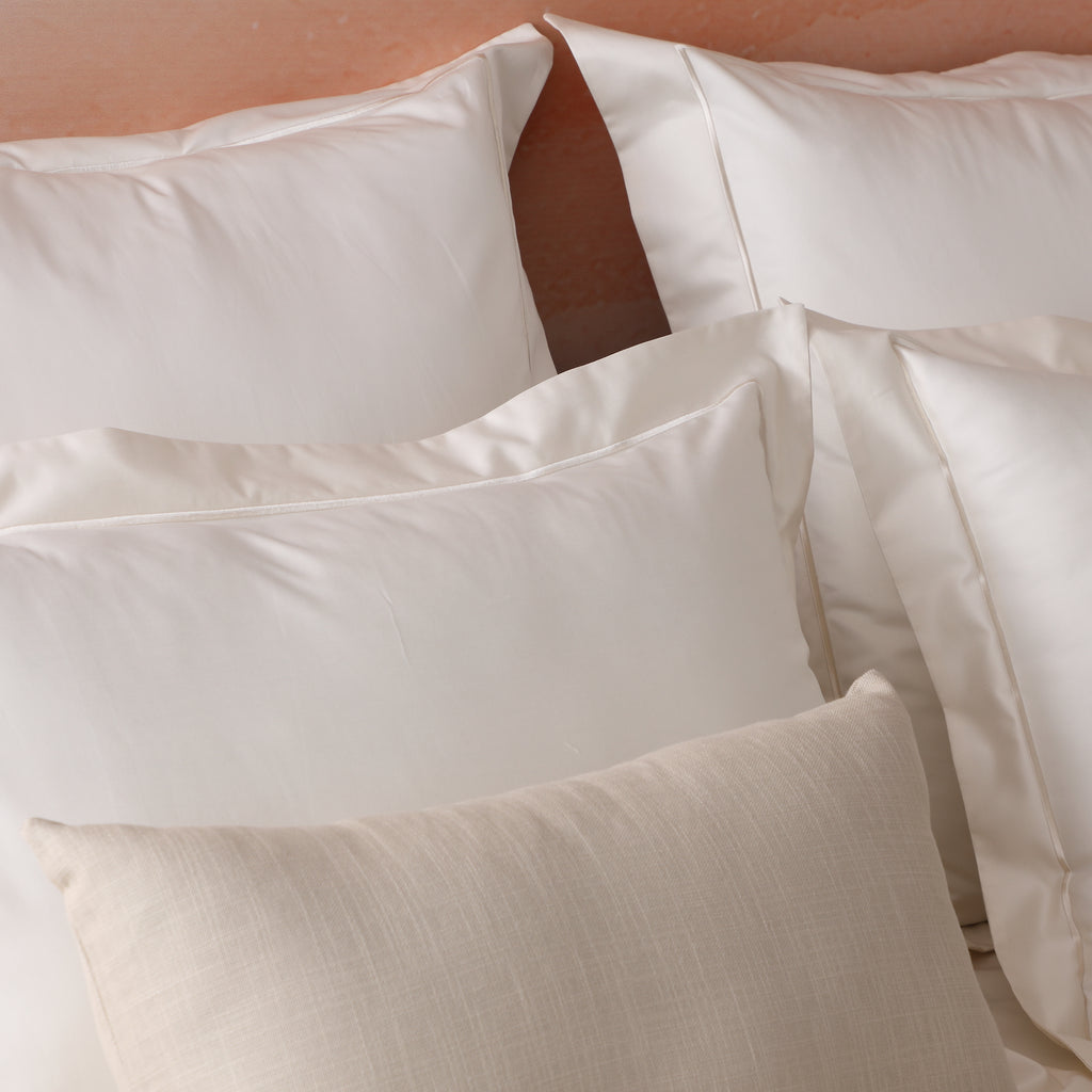 600TC organic cotton duvet cover set in ivory on a made bed – silky smooth certified organic cotton, grows softer with every wash, king and super king sizes