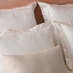 600TC organic cotton duvet cover set in ivory on a made bed – silky smooth certified organic cotton, grows softer with every wash, king and super king sizes