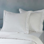 White euro pillowcase set on a styled bed – 1000 TC organic cotton with double embroidered border, 65x65cm, Whites of London India