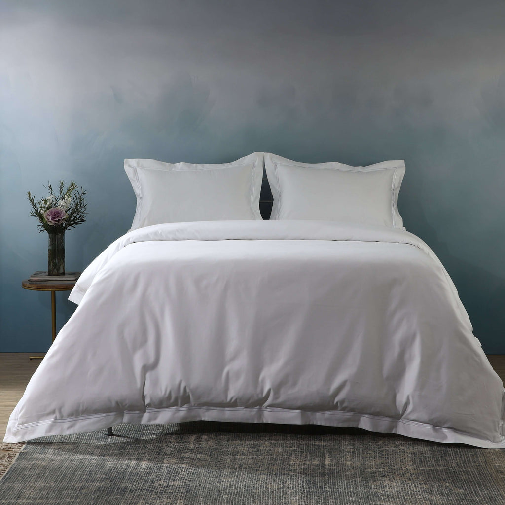 Luxury white euro organic cotton pillowcases on a made bed – 1000 TC organic cotton and soft