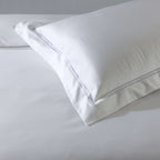 1000 thread count white organic cotton embroidered pillowcase set detailed image – double-stitched embroidery on face and flange