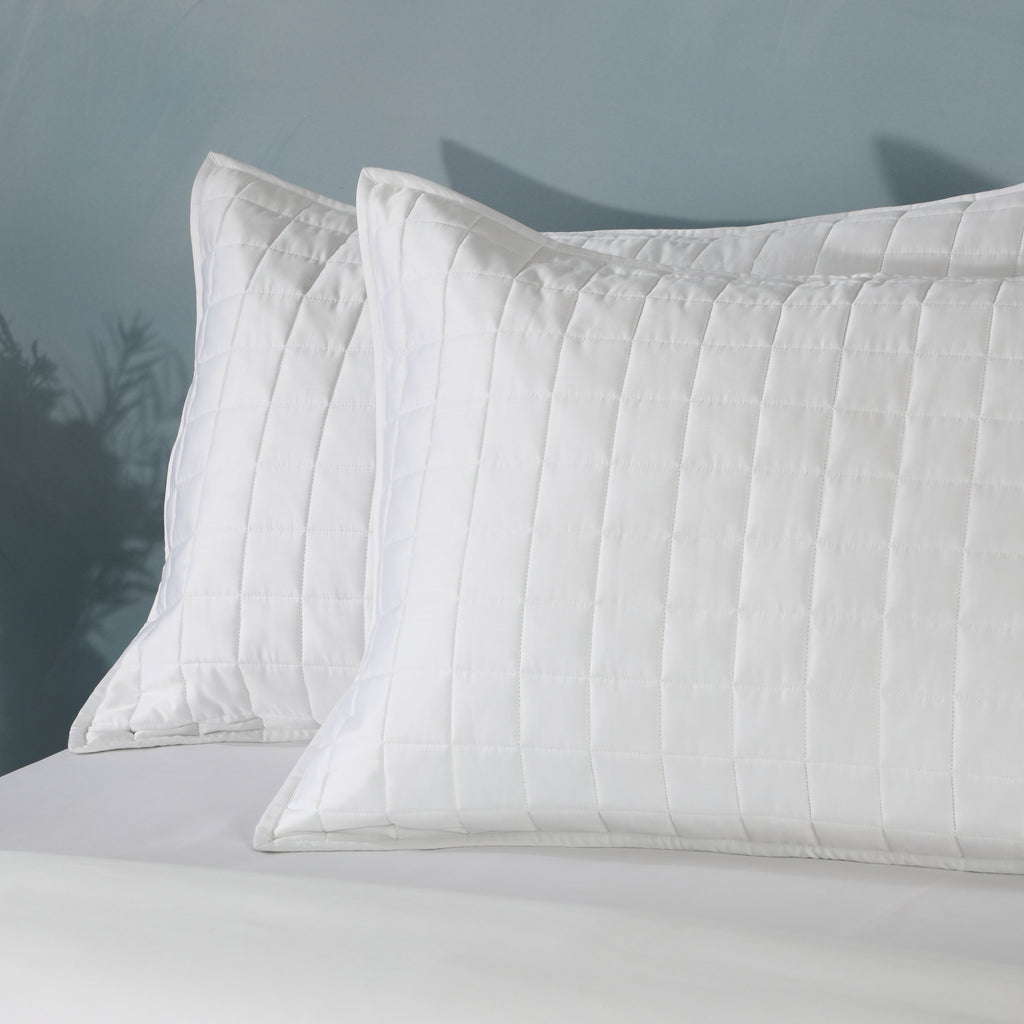 Bamboo cotton bedspread set in white styled on a bed – lightweight quilted coverlet in a 60/40 bamboo cotton blend, gentle on skin and breathable, single and king sizes