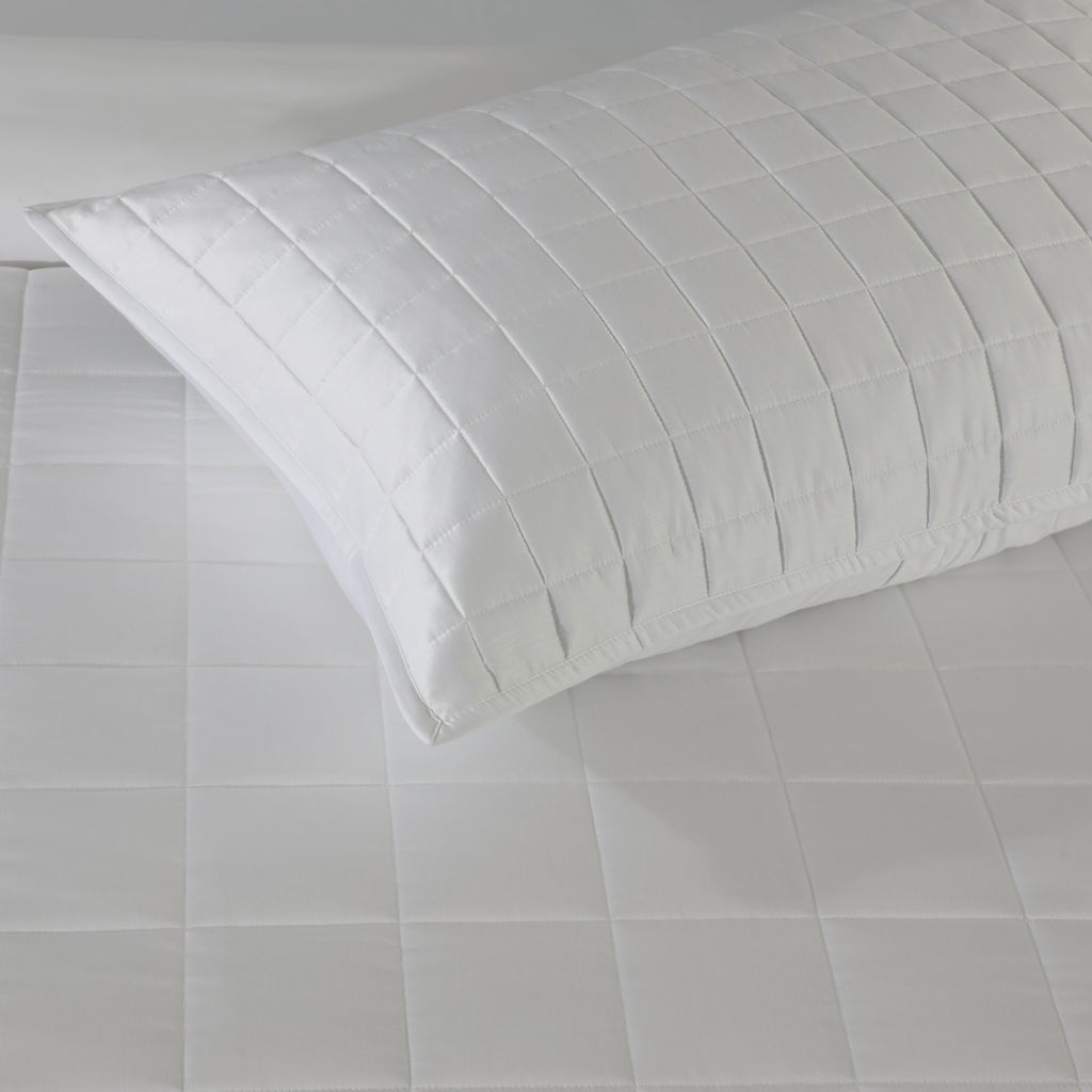 Close-up of white bamboo cotton coverlet quilting – timeless stitch pattern on a soft 60% bamboo 40% cotton blend, hypoallergenic and moisture-wicking, Whites of London