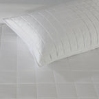 Close-up of white bamboo cotton coverlet quilting – timeless stitch pattern on a soft 60% bamboo 40% cotton blend, hypoallergenic and moisture-wicking, Whites of London