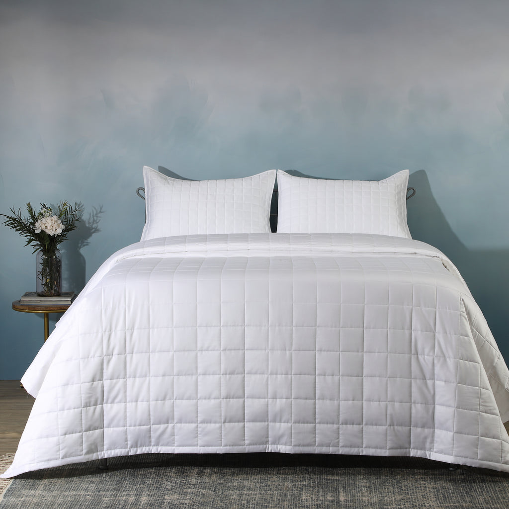 White bamboo cotton bedspread set on a luxury styled bed – 60% bamboo 40% cotton coverlet with timeless quilting design, lightweight and breathable, Whites of London India