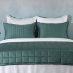 Teal bamboo cotton coverlet and sham set on a made bed – naturally hypoallergenic and moisture-wicking bamboo cotton blend, soft quilted texture, Whites of London