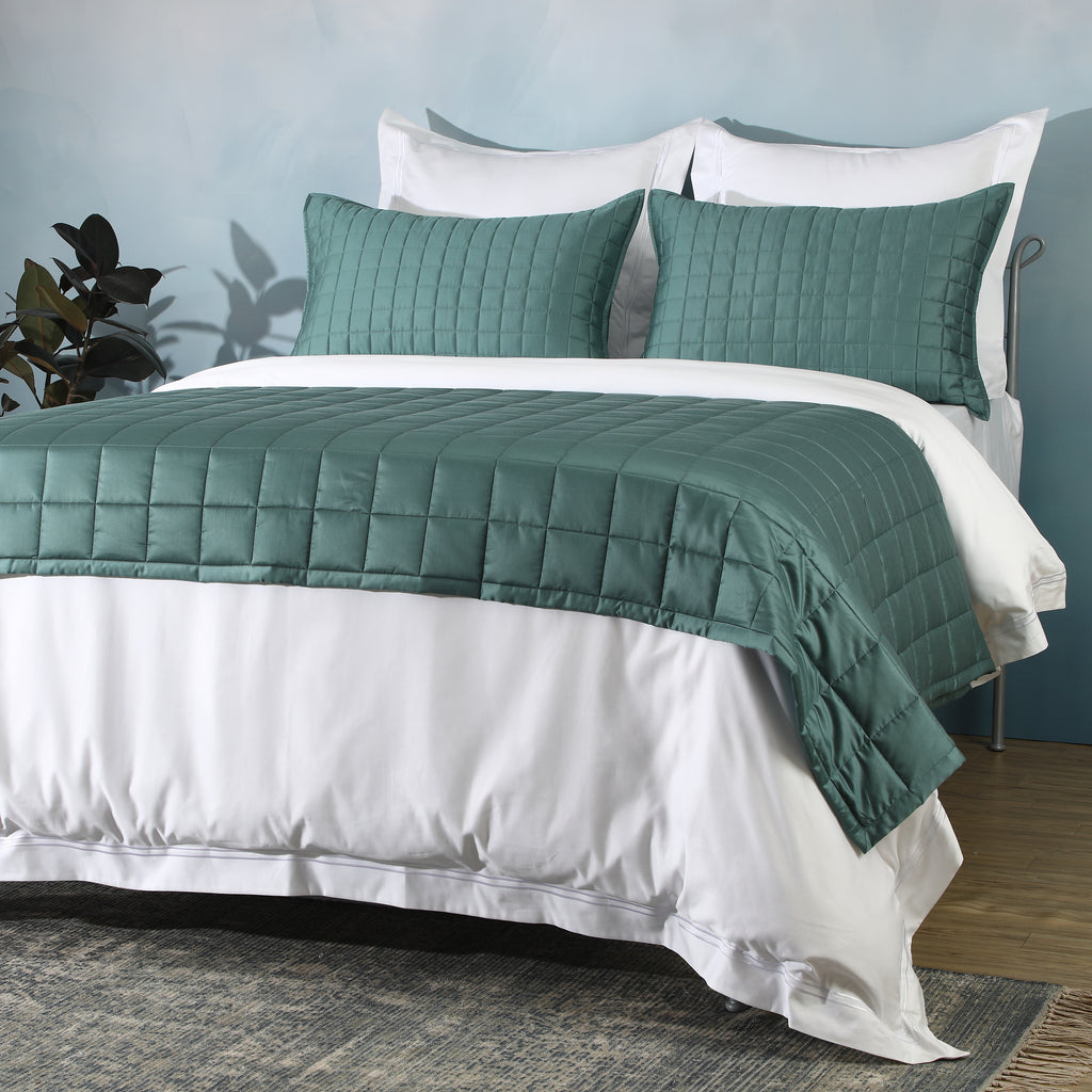 Bamboo cotton bedspread set in teal styled on a bed – lightweight quilted coverlet in a 60/40 bamboo cotton blend, gentle on skin and naturally breathable