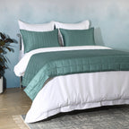 Close-up of teal bamboo cotton bedspread quilting – timeless stitch pattern on a soft 60% bamboo 40% cotton blend, hypoallergenic and moisture-wicking, Whites of London