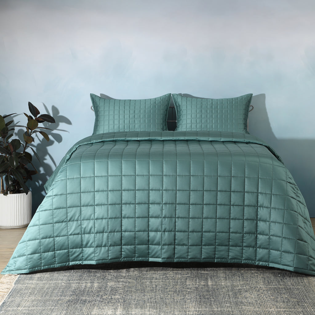 Teal bamboo cotton bedspread set on a luxury styled bed – 60% bamboo 40% cotton coverlet with timeless quilting design, lightweight and breathable, Whites of London India