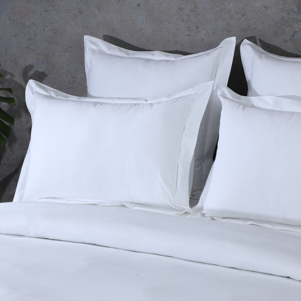 Luxury white oxford pillowcases on a neatly made bed – 600 thread count organic cotton, breathable and durable, Whites of London India