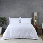 Two white organic cotton oxford pillowcases flat lay – 600 TC with single-stitched embroidered border, 50x75cm set of 2