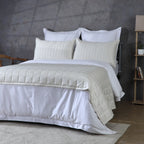 Bamboo cotton bedspread set in ivory styled on a bed – lightweight 60/40 bamboo cotton coverlet, gentle on skin and breathable, single and king sizes, Whites of London