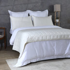 Close-up of ivory bamboo cotton coverlet quilting – timeless stitch pattern on a soft 60% bamboo 40% cotton blend, moisture-wicking and naturally durable
