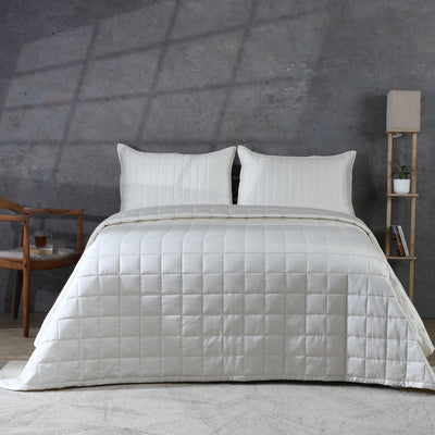 Ivory bamboo cotton bedspread set on a luxury styled bed – 60% bamboo 40% cotton coverlet with timeless quilting design, lightweight and breathable, Whites of London India