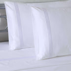 White 1000 TC organic cotton housewife pillowcase with three-line embroidery detail – dense, silky weave, part of the embroidered sheet set by Whites of London