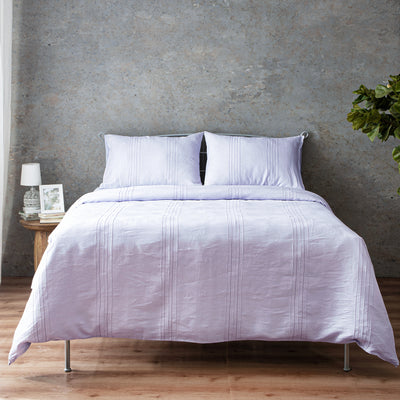 Lavender Blush Heirloom European flax linen duvet cover set on a luxury styled bed – hand-tailored pintucks and Victorian hemstitching, 100% pure linen, Whites of London India